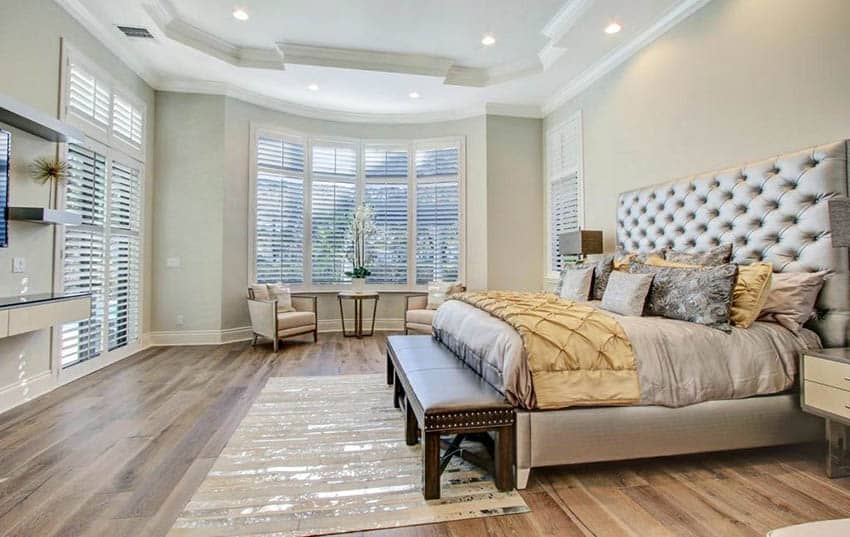 Master bedroom with wood plank flooring
