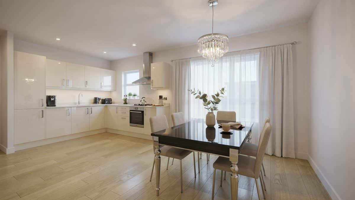 Black glass table with silver legs below a crystal chandelier near white cabinets