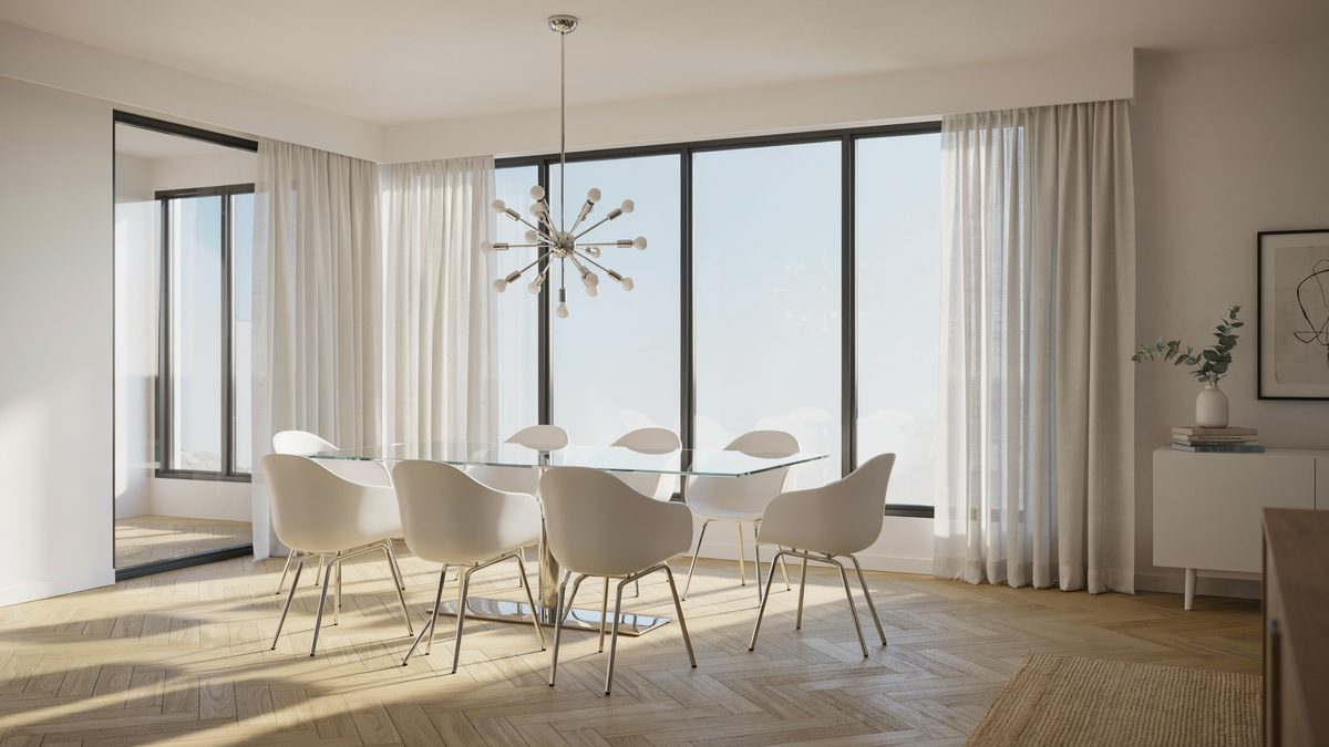 Glass top table ringed with white molded chairs beneath a sputnik chandelier