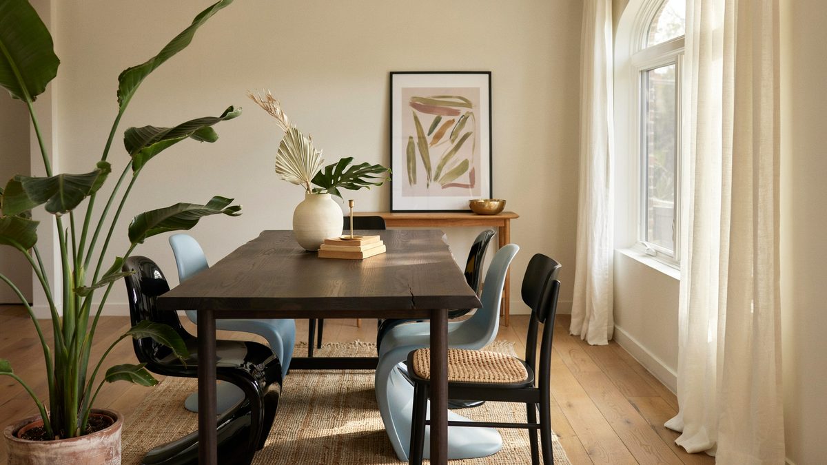 Dark espresso table paired with mismatched black and pale blue side chairs