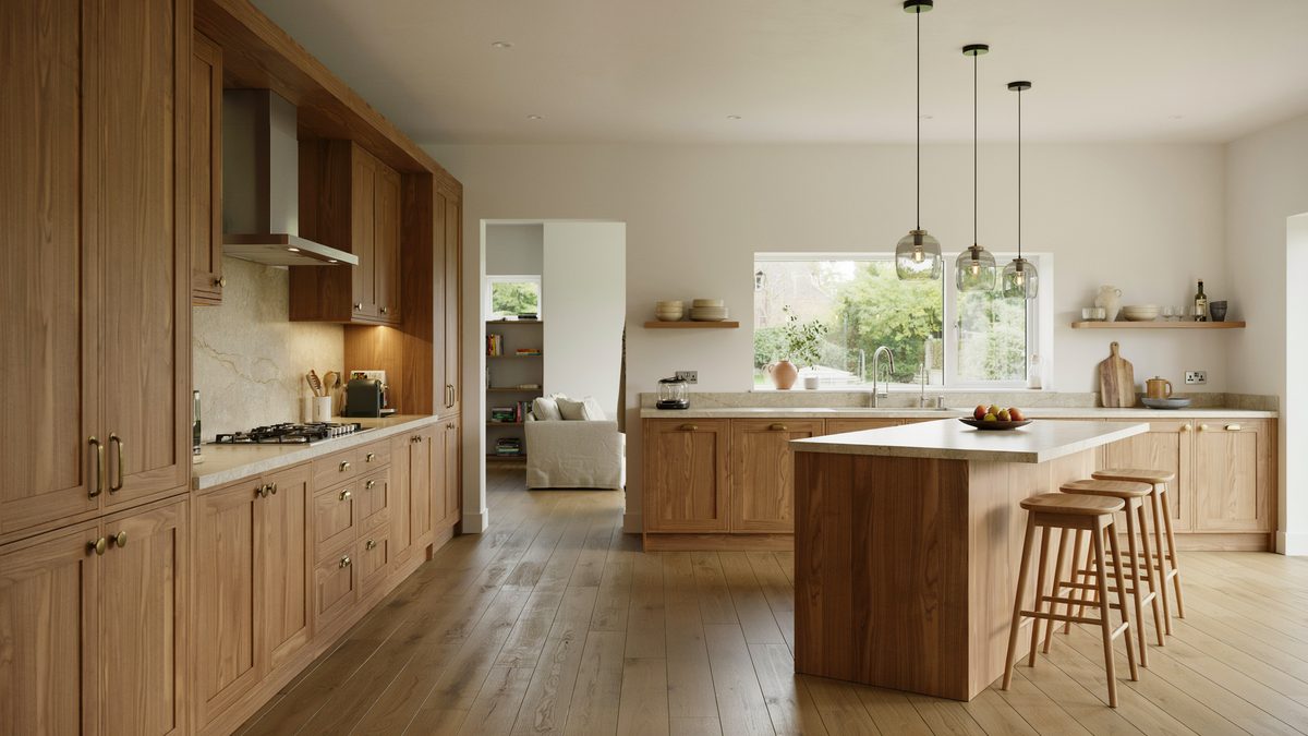 Walnut cabinets with beige sandstone counters and a corner bar island