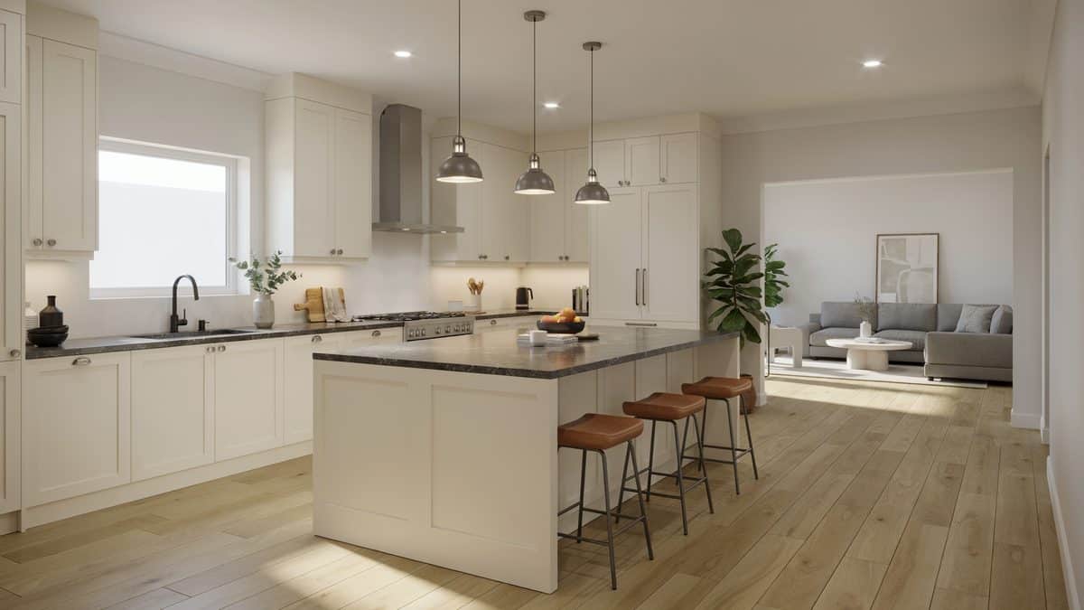 Paneled cabinets topped with dark gray granite in a gray and white scheme
