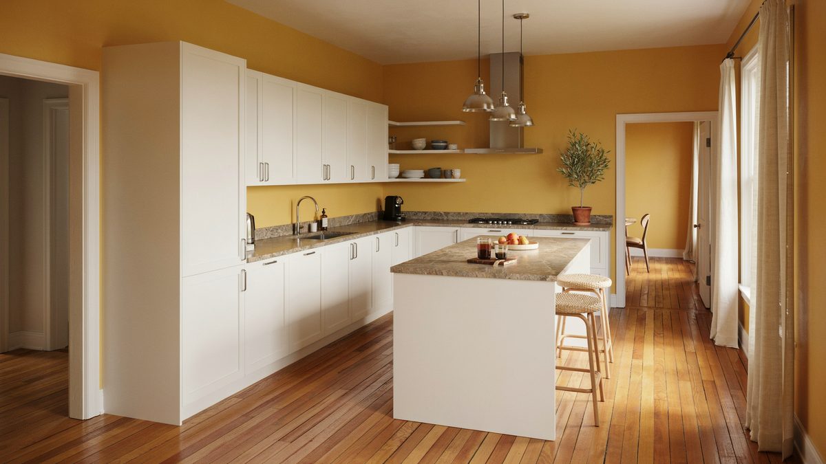 White panel cabinets and brown granite against bold yellow gold walls