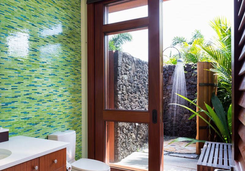 Outdoor rain shower with tropical plants