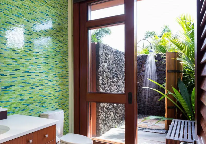 Outdoor shower with tropical plants
