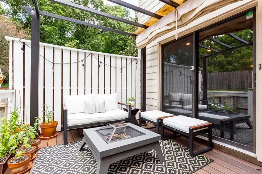 Small modern deck with pergola privacy fence and gas fire pit