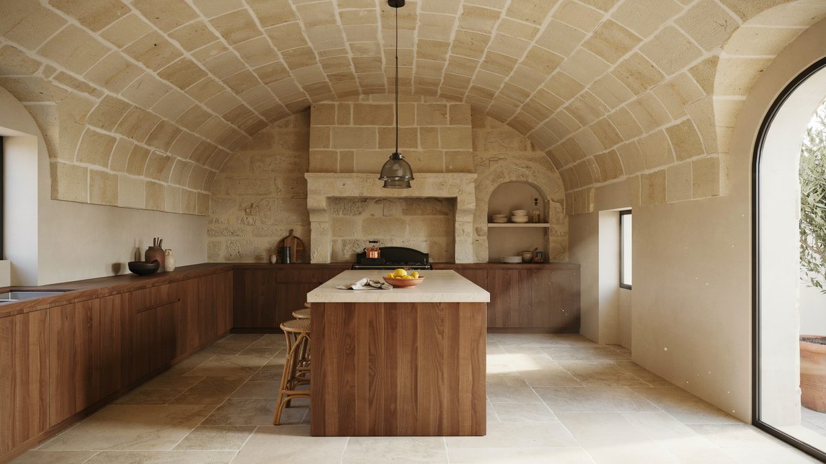 Barrel arched limestone ceiling above dark walnut handleless cabinets and natural stone flooring