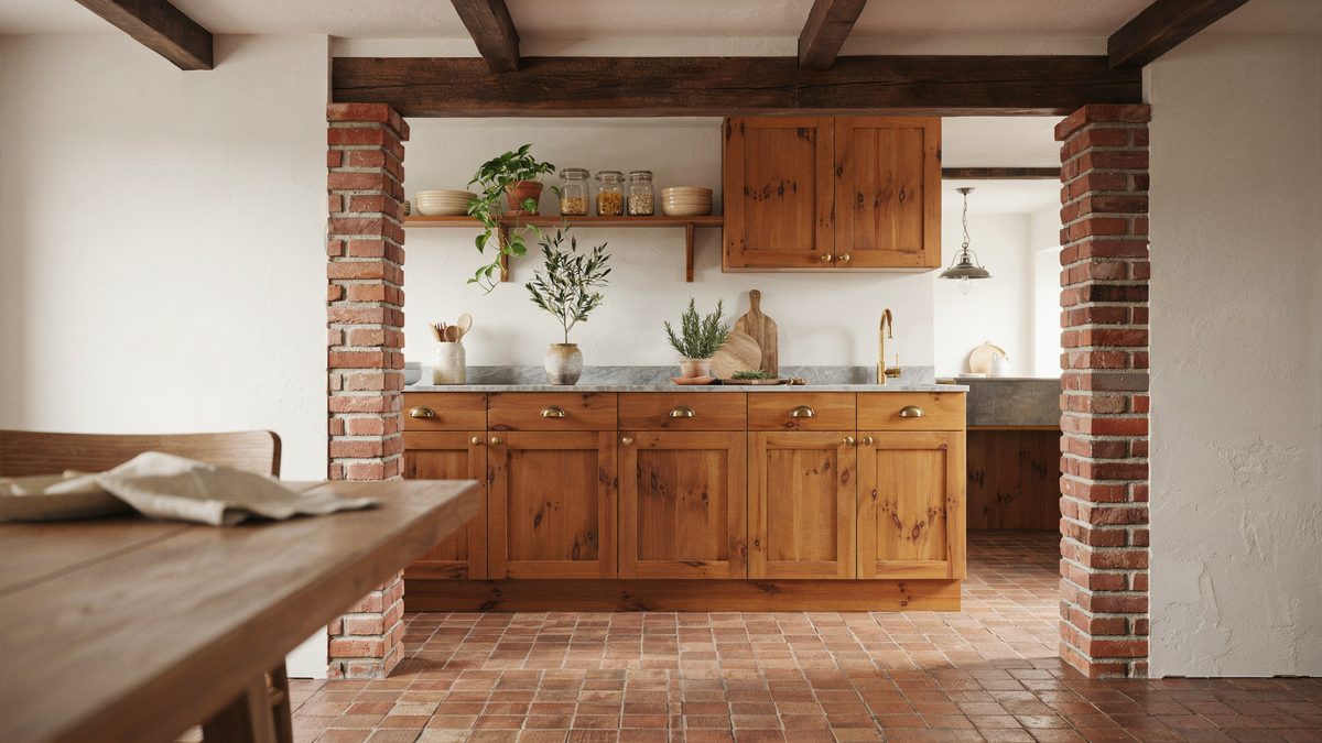 Brick flooring and columns paired with teak cabinets and gray granite counters