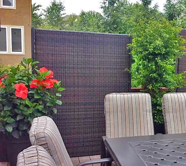 Wicker fence partition for patio