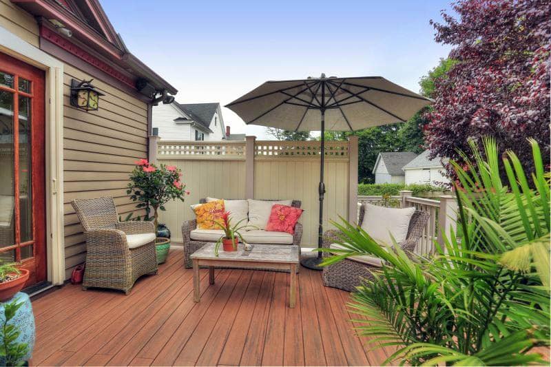 Composite deck design in backyard of craftsman style house