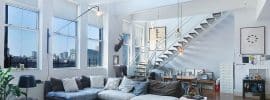 contemporary-loft-with-floating-staircase-and-white-railings