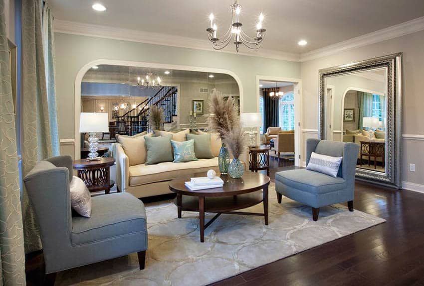 Living room with gray accent chairs and cream loveseat