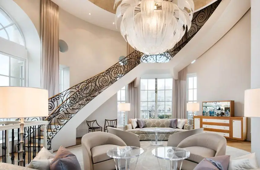 Room with wrought iron curving staircase