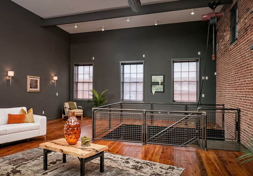 Loft living room with chain link staircase railing