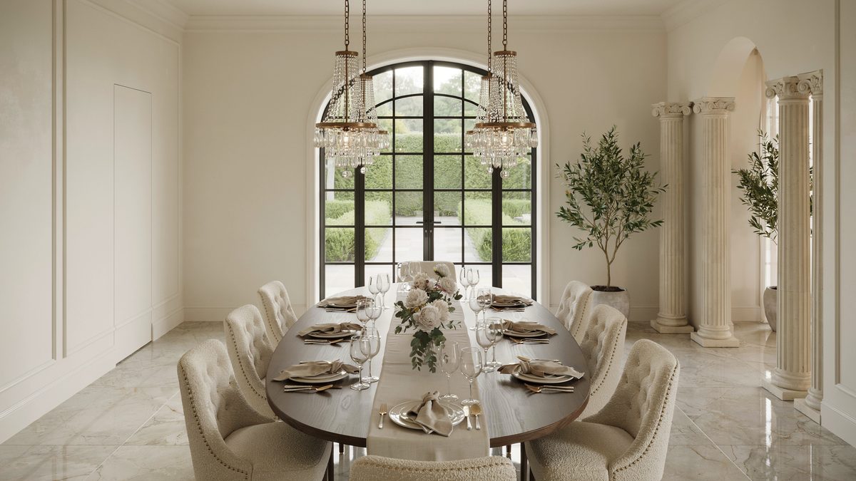 Tufted ivory chairs circle an oval table beneath twin crystal chandeliers