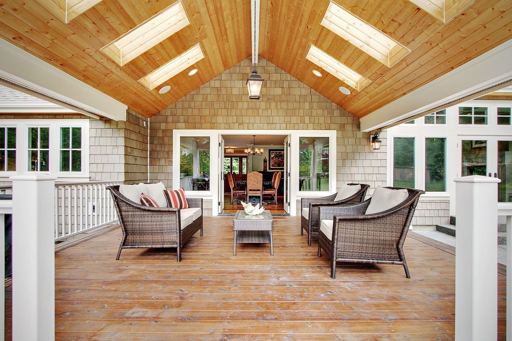 Wood deck with covered roof, cathedral ceiling and skylights