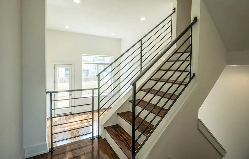 Modern metal railing with steps made of engineered wood