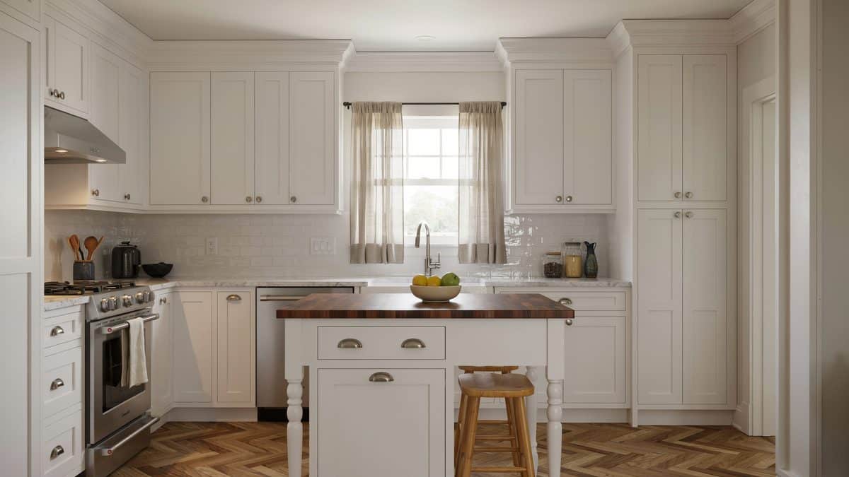 Movable island with mahogany eat in countertop beside white granite counters