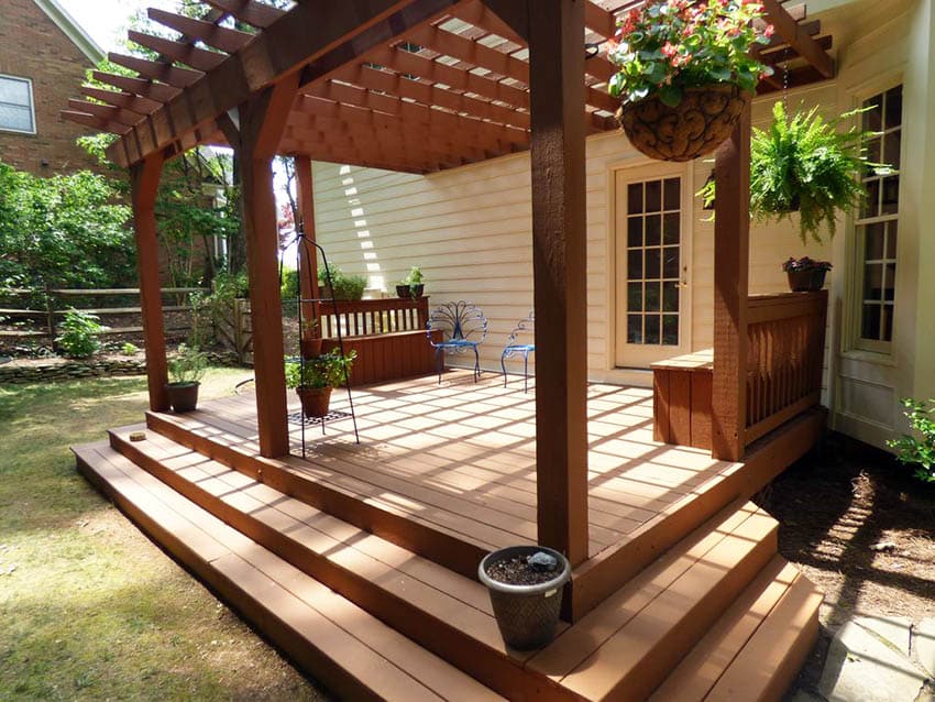 Painted deck with custom sitting benches and pergola