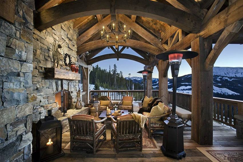 Rustic wood deck with exposed beams and outdoor fireplace