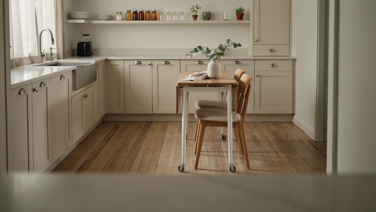 White island with walnut drop leaf top opened into an oblong table