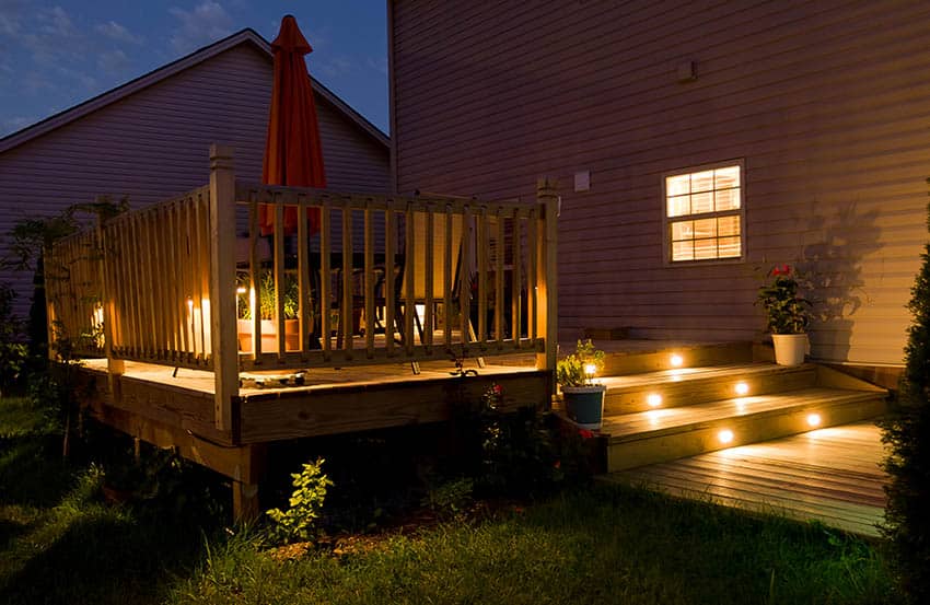 Wood deck with built in lights under steps