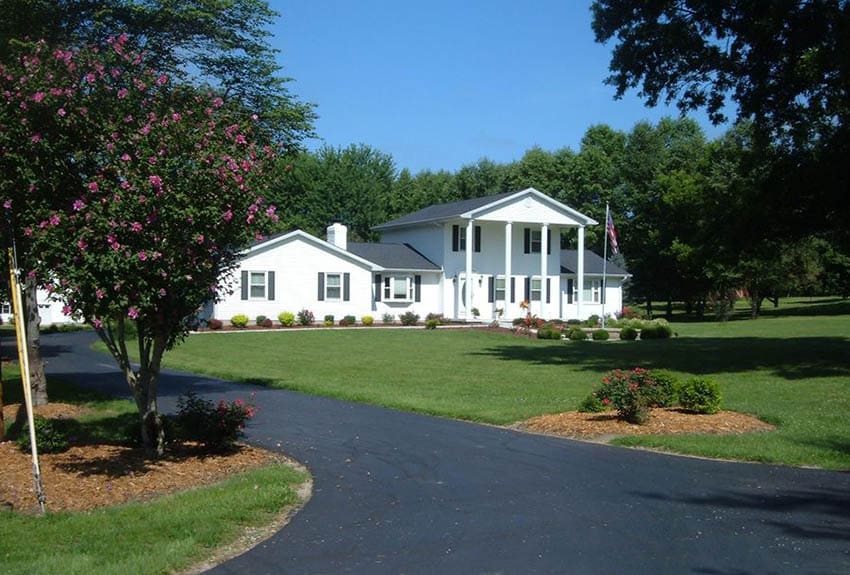 Asphalt driveway at traditional house