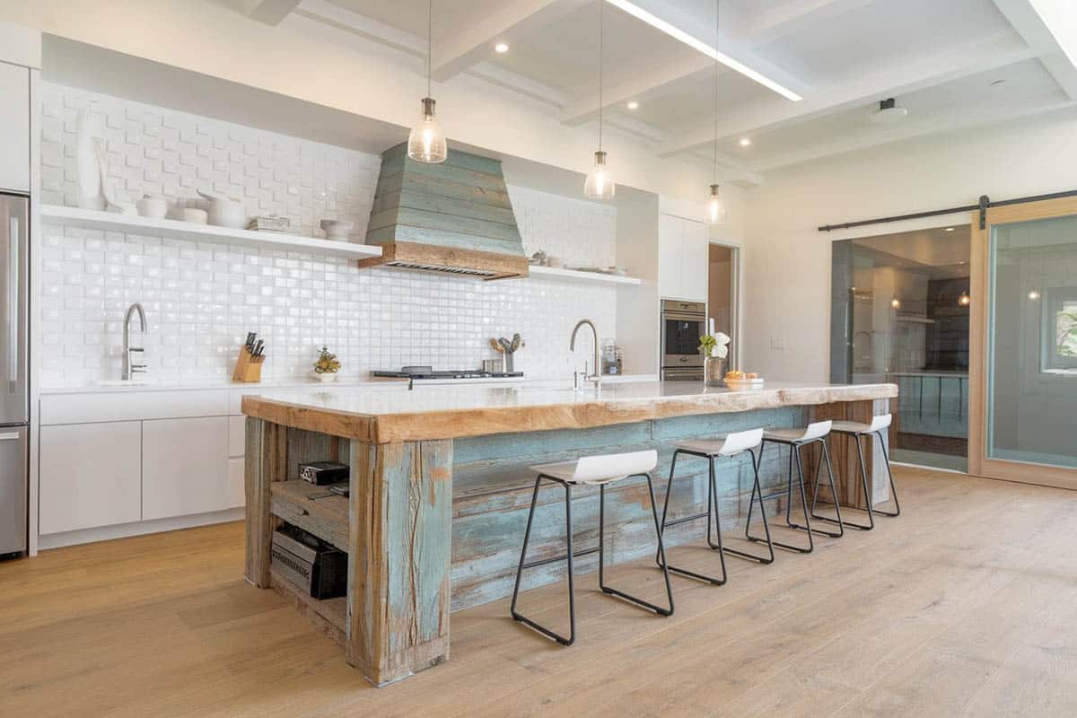 Dark grey base with white quartz countertops and white chairs
