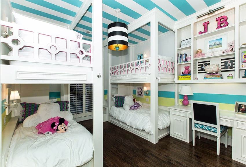 Decorated kids bedroom with bunk beds and built in bookshelf