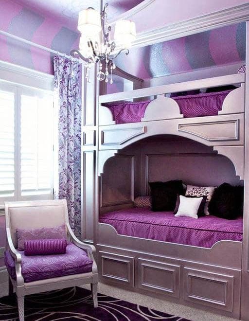 Fun kids bedroom with bunk beds and purple color theme