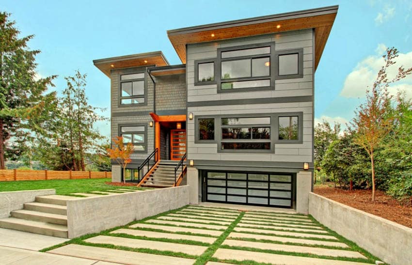 Grass and concrete driveway at modern home