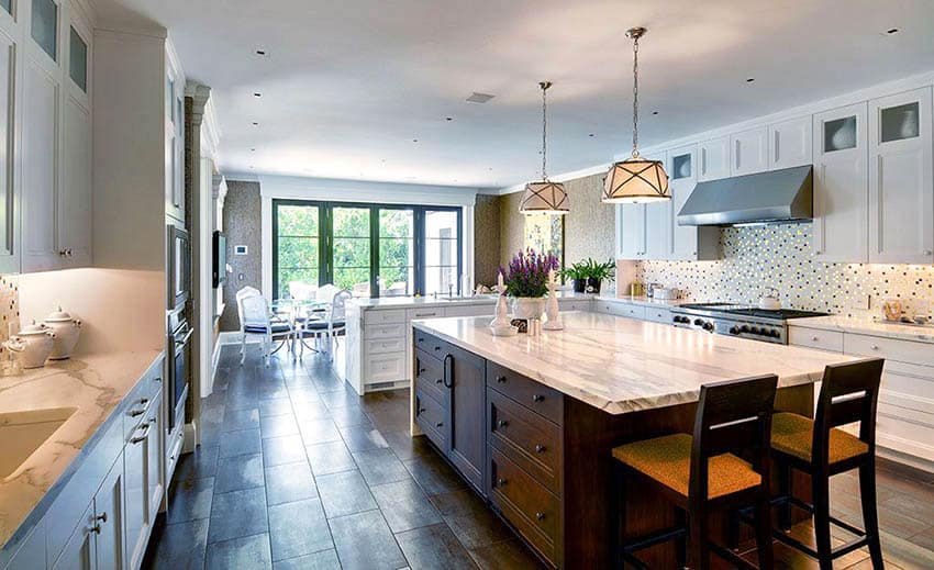 Kitchen with light travertine counters and wood look porcelain floor tile