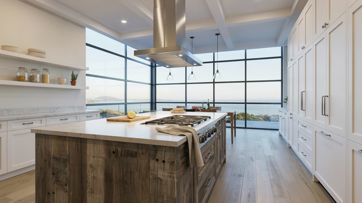 Coastal kitchen island in weathered plank wood beneath a wall of ocean windows