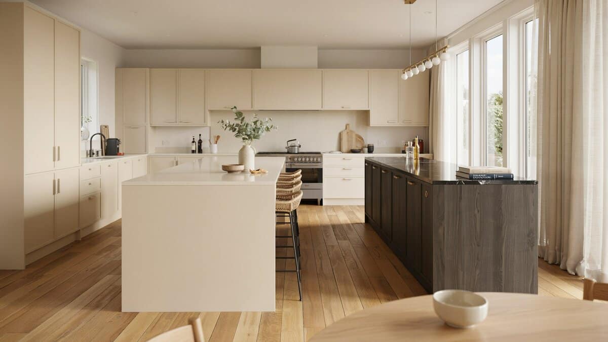 Light beige cabinets with a second dark ash island under a chandelier