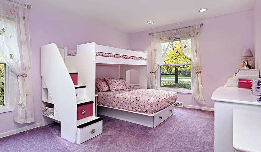 Girl’s room with bunk bed with stairs and storage under bed