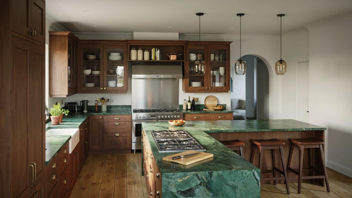 Deep walnut stain with an emerald granite island cooktop and raised bar