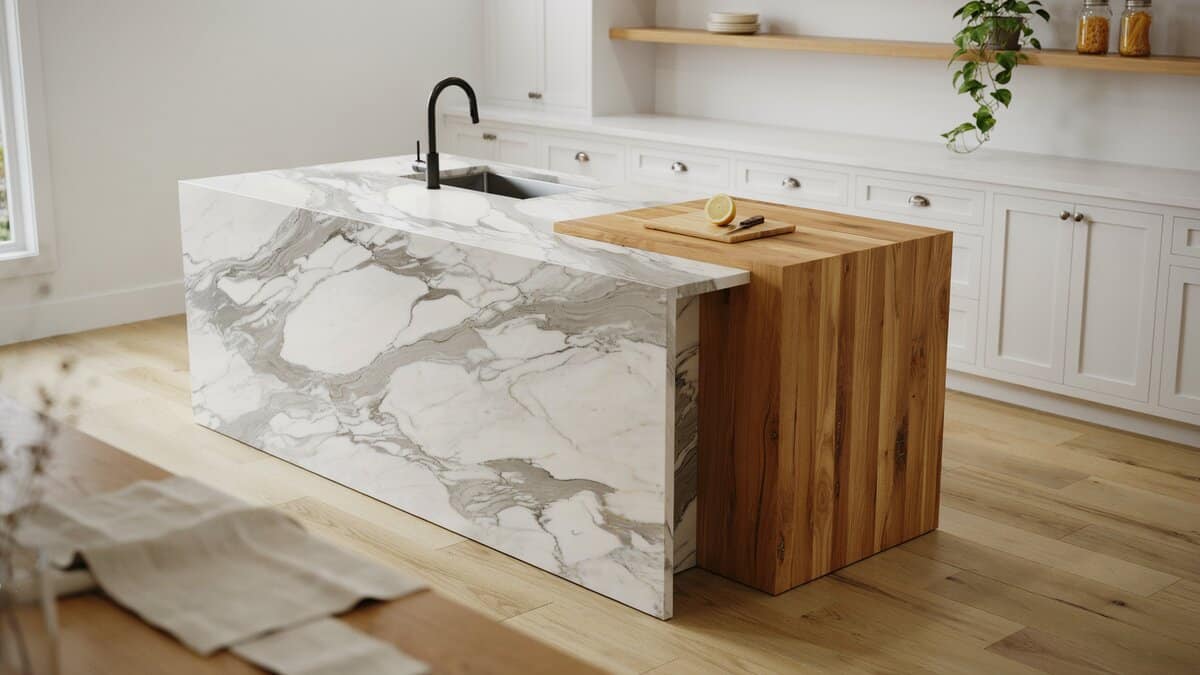 White painted cabinets with an island combining Calacatta marble and butcher block wood