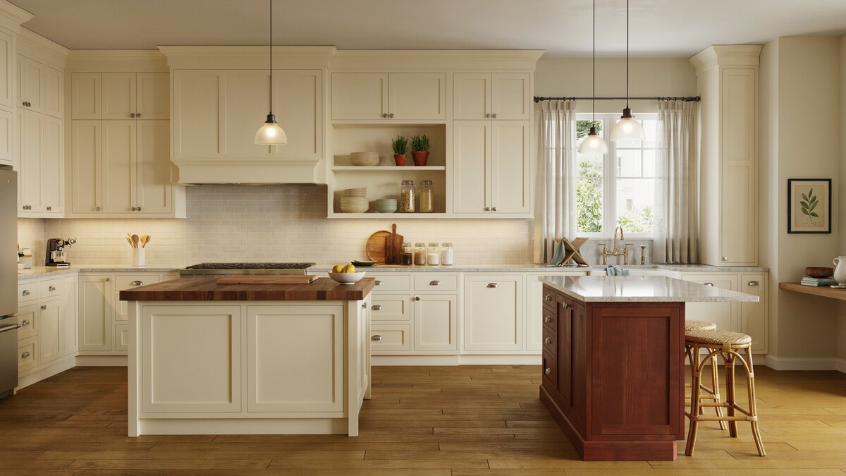 Country kitchen with cream raised panel cabinets and two stained wood islands