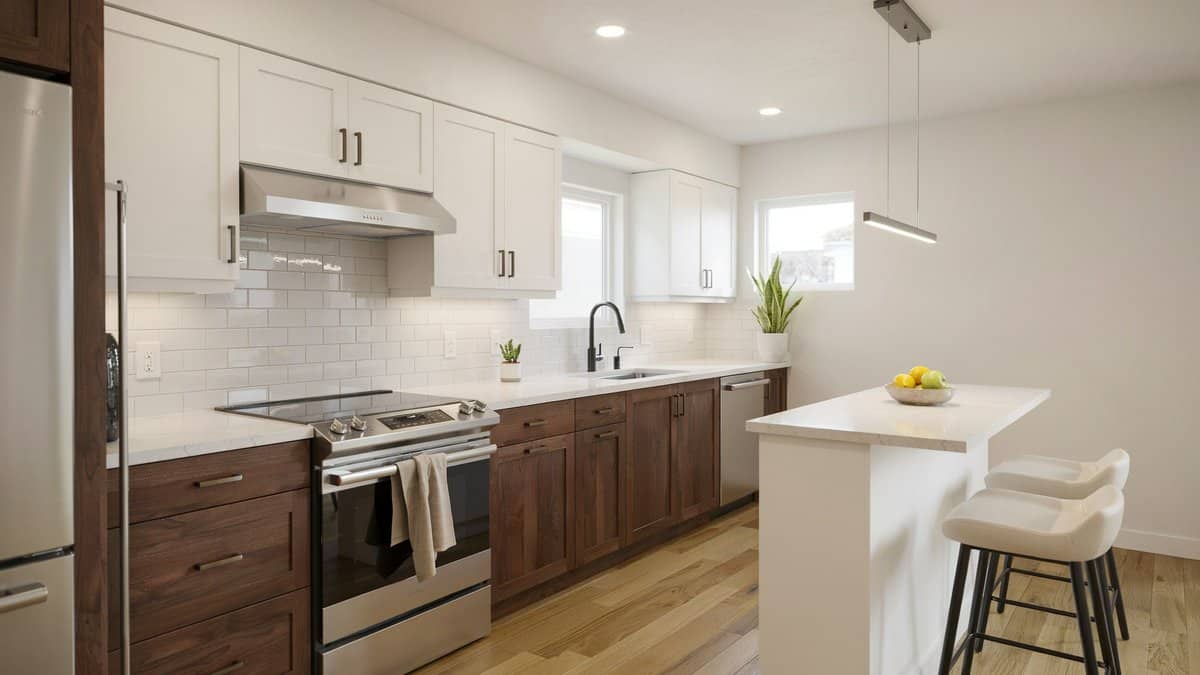Dark walnut cabinets with white subway tile and a white bar island