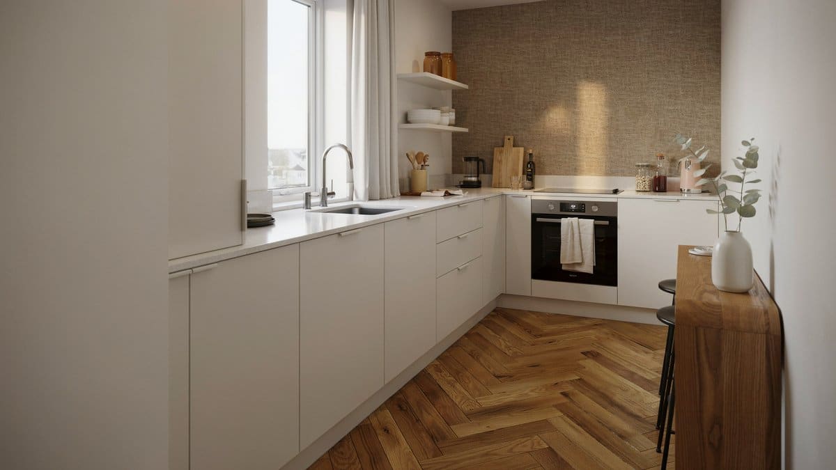 White L shape cabinets above a chevron wood floor and textured wallpaper