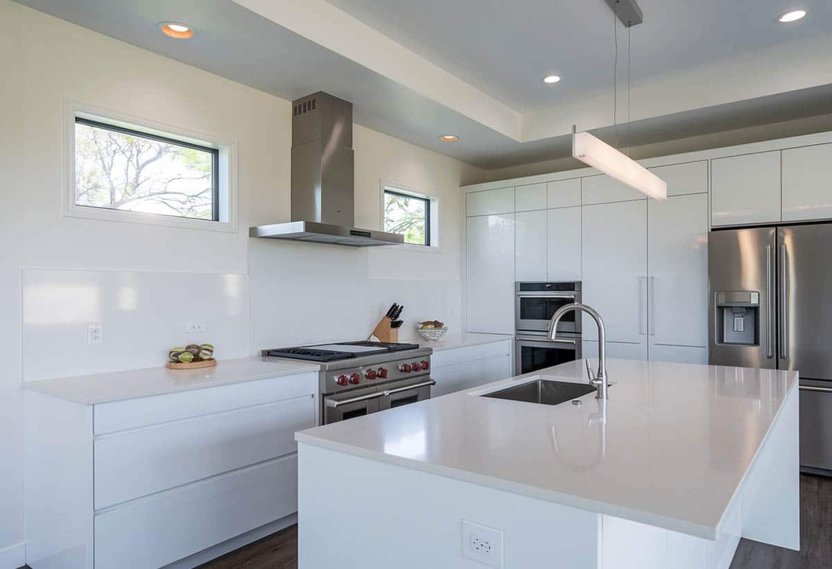 Kitchen with stainless appliances and solid surface island