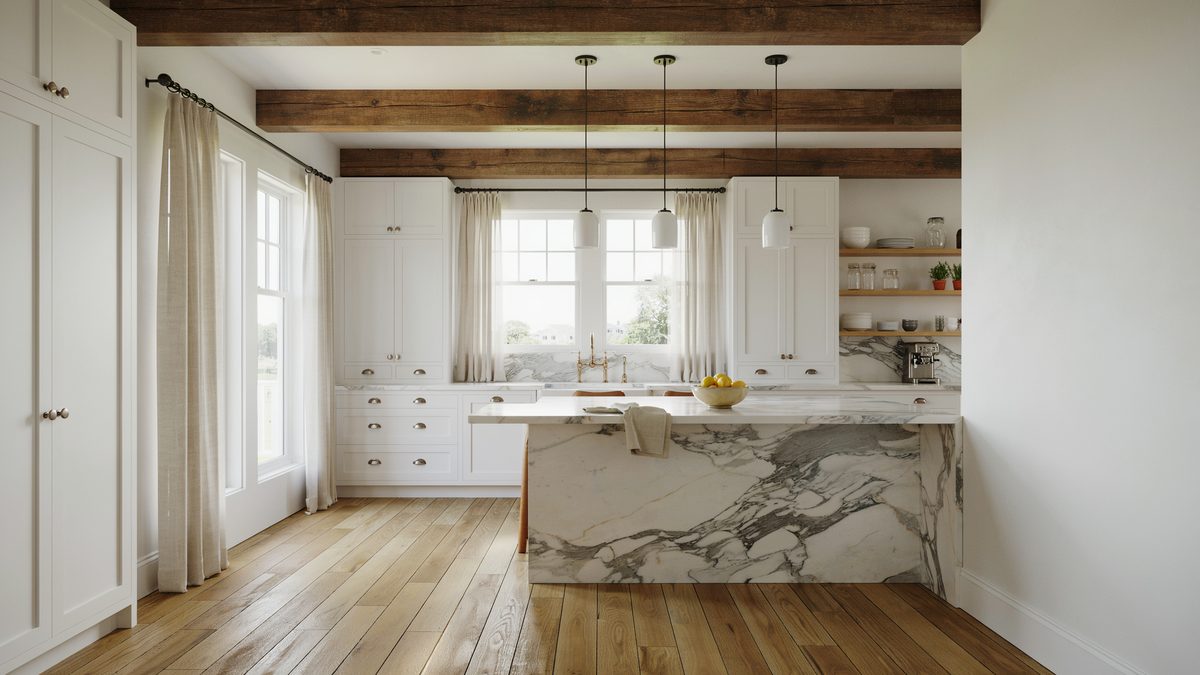 Exposed wood beams above a veined marble island in a traditional white kitchen