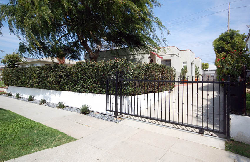 Aluminum driveway gate with sloped drive