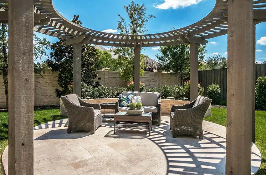 Circular pergola with concrete patio and sitting area