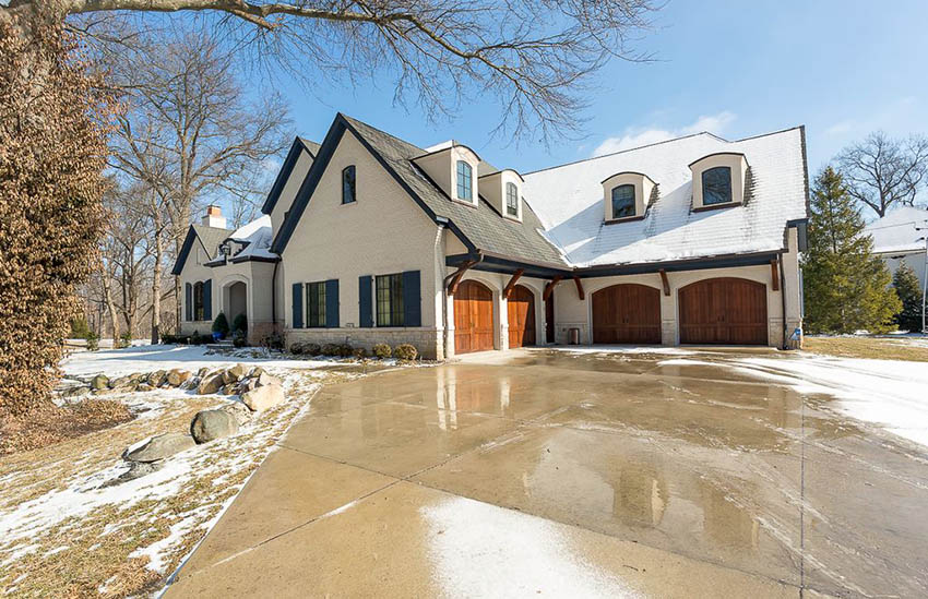 French country house with heated stained driveway