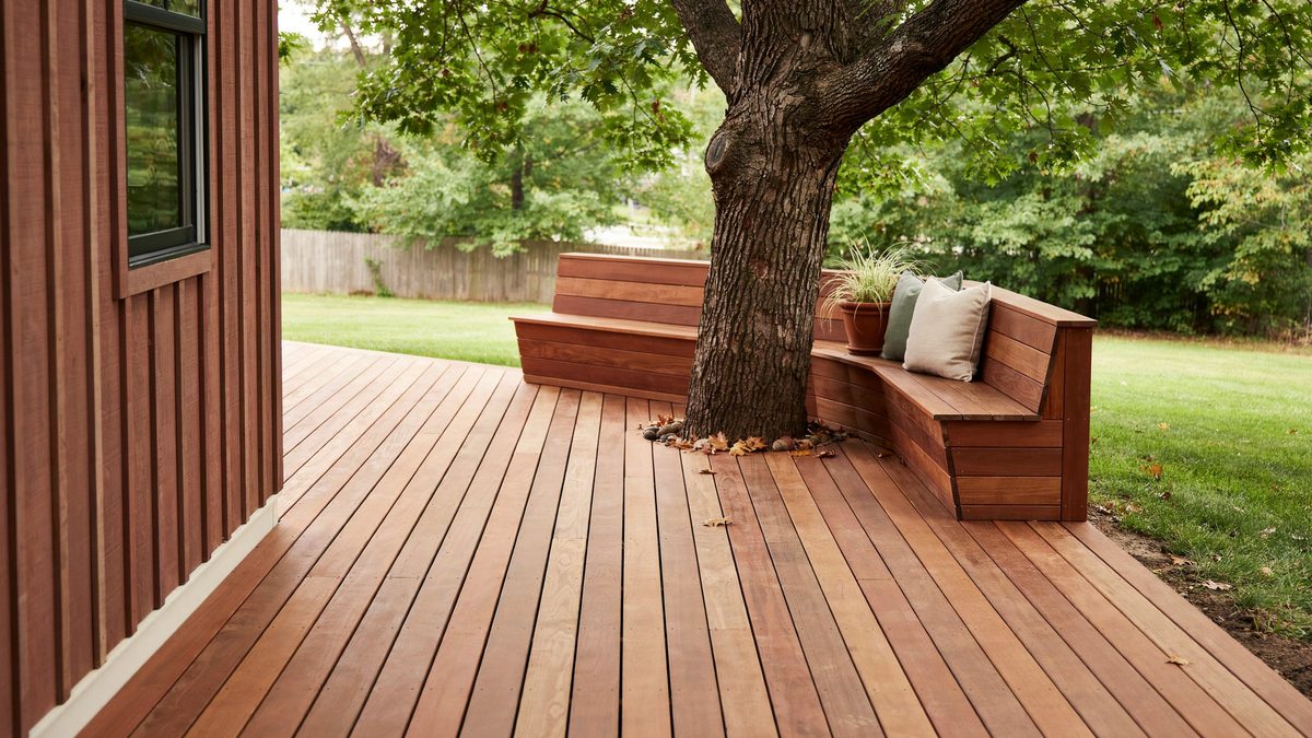 Red cedar deck built around a mature tree with wrapping bench seating