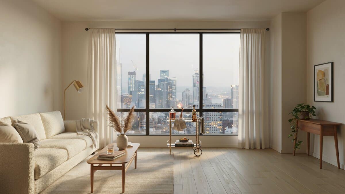 Beautiful living room with cream color furniture, small portable home bar and city skyline views