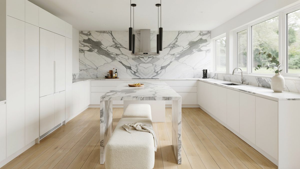 Full slab marble backsplash and hood above a white island with bench seating