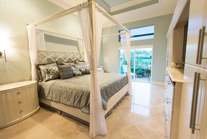 Four post bed curtains and many pillows