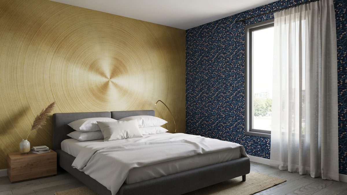 Gold radial accent panel beside blue patterned wallpaper and a charcoal bed
